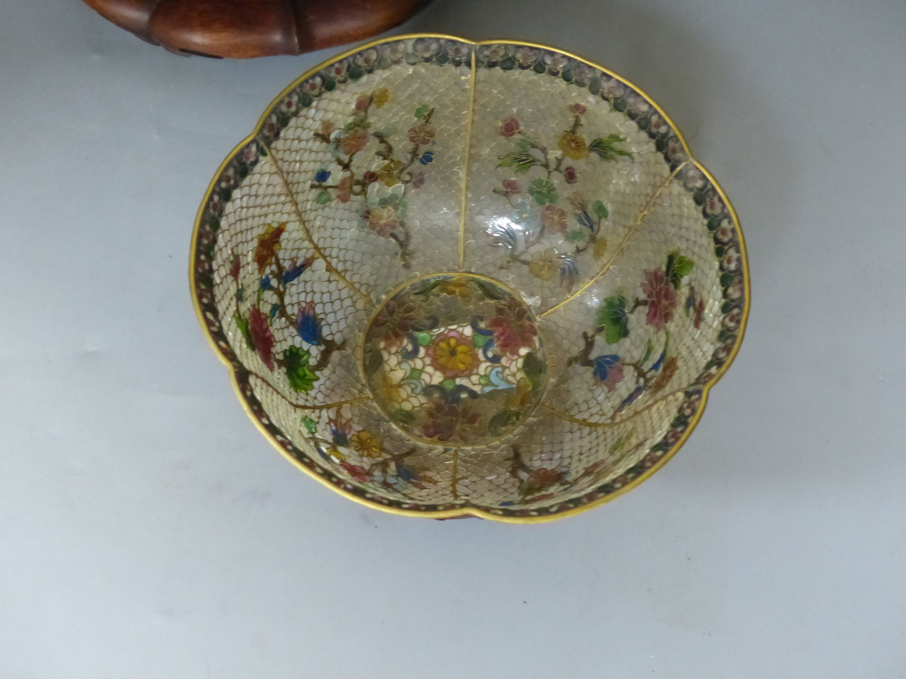 A Chinese plique a jour enamel bowl on stand, and a Chinese famille rose bowl on stand, largest 33cm diameter